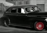 Standbild Wenden mit hoher Geschwindigkeit mit dem Auto vor Stadion Akron Ohio USA, 1941, aus Sekunde 25 historischem Filmmaterial Videoclip 65675030482