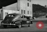Standbild Wenden mit hoher Geschwindigkeit mit dem Auto vor Stadion Akron Ohio USA, 1941, aus Sekunde 28 historischem Filmmaterial Videoclip 65675030482