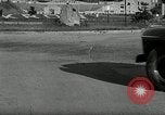 Standbild Wenden mit hoher Geschwindigkeit mit dem Auto vor Stadion Akron Ohio USA, 1941, aus Sekunde 30 historischem Filmmaterial Videoclip 65675030482