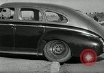 Standbild Wenden mit hoher Geschwindigkeit mit dem Auto vor Stadion Akron Ohio USA, 1941, aus Sekunde 34 historischem Filmmaterial Videoclip 65675030482