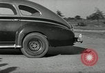 Standbild Wenden mit hoher Geschwindigkeit mit dem Auto vor Stadion Akron Ohio USA, 1941, aus Sekunde 36 historischem Filmmaterial Videoclip 65675030482