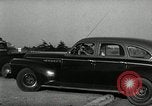 Standbild Wenden mit hoher Geschwindigkeit mit dem Auto vor Stadion Akron Ohio USA, 1941, aus Sekunde 48 historischem Filmmaterial Videoclip 65675030482