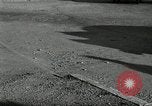 Standbild Wenden mit hoher Geschwindigkeit mit dem Auto vor Stadion Akron Ohio USA, 1941, aus Sekunde 52 historischem Filmmaterial Videoclip 65675030482