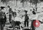 Image of railway construction and paving of muddy roads United States USA, 1927, second 26 stock footage video 65675030520