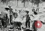 Image of railway construction and paving of muddy roads United States USA, 1927, second 27 stock footage video 65675030520
