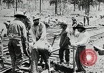 Image of railway construction and paving of muddy roads United States USA, 1927, second 28 stock footage video 65675030520