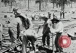 Image of railway construction and paving of muddy roads United States USA, 1927, second 29 stock footage video 65675030520