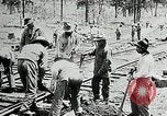 Image of railway construction and paving of muddy roads United States USA, 1927, second 34 stock footage video 65675030520