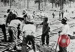 Image of railway construction and paving of muddy roads United States USA, 1927, second 35 stock footage video 65675030520