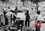 Image of railway construction and paving of muddy roads United States USA, 1927, second 36 stock footage video 65675030520