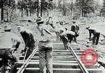 Image of railway construction and paving of muddy roads United States USA, 1927, second 38 stock footage video 65675030520