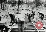 Image of railway construction and paving of muddy roads United States USA, 1927, second 39 stock footage video 65675030520