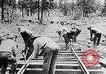 Image of railway construction and paving of muddy roads United States USA, 1927, second 40 stock footage video 65675030520