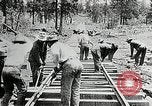 Image of railway construction and paving of muddy roads United States USA, 1927, second 42 stock footage video 65675030520