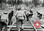 Image of railway construction and paving of muddy roads United States USA, 1927, second 43 stock footage video 65675030520