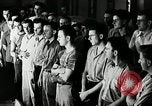 Standbild Goodyear Mitarbeiter Slogan Akron Ohio USA, 1941, aus Sekunde 10 historischem Filmmaterial Videoclip 65675030572