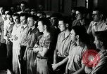 Standbild Goodyear Mitarbeiter Slogan Akron Ohio USA, 1941, aus Sekunde 11 historischem Filmmaterial Videoclip 65675030572
