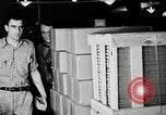 Standbild Goodyear Mitarbeiter Slogan Akron Ohio USA, 1941, aus Sekunde 19 historischem Filmmaterial Videoclip 65675030572