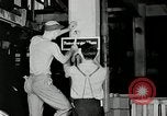 Standbild Goodyear Mitarbeiter Slogan Akron Ohio USA, 1941, aus Sekunde 26 historischem Filmmaterial Videoclip 65675030572