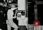 Standbild Goodyear Mitarbeiter Slogan Akron Ohio USA, 1941, aus Sekunde 27 historischem Filmmaterial Videoclip 65675030572