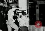 Standbild Goodyear Mitarbeiter Slogan Akron Ohio USA, 1941, aus Sekunde 28 historischem Filmmaterial Videoclip 65675030572