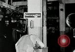 Standbild Goodyear Mitarbeiter Slogan Akron Ohio USA, 1941, aus Sekunde 33 historischem Filmmaterial Videoclip 65675030572