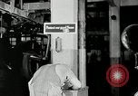Standbild Goodyear Mitarbeiter Slogan Akron Ohio USA, 1941, aus Sekunde 34 historischem Filmmaterial Videoclip 65675030572