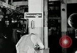 Standbild Goodyear Mitarbeiter Slogan Akron Ohio USA, 1941, aus Sekunde 35 historischem Filmmaterial Videoclip 65675030572