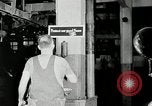 Standbild Goodyear Mitarbeiter Slogan Akron Ohio USA, 1941, aus Sekunde 38 historischem Filmmaterial Videoclip 65675030572