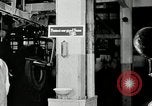 Standbild Goodyear Mitarbeiter Slogan Akron Ohio USA, 1941, aus Sekunde 39 historischem Filmmaterial Videoclip 65675030572