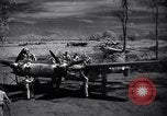 Immagine di Meccanica del 80th Fighter Squadron lavorare su un P-38 Nuova Guinea, 1944, secondo 3 filmato di repertorio 65675030624