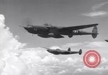 Image of P-38 of 13th Army Air Force jettisons auxiliary fuel tanks Pacific Theater, 1943, second 9 stock footage video 65675030627
