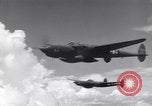 Image of P-38 of 13th Army Air Force jettisons auxiliary fuel tanks Pacific Theater, 1943, second 11 stock footage video 65675030627