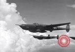 Image of P-38 of 13th Army Air Force jettisons auxiliary fuel tanks Pacific Theater, 1943, second 16 stock footage video 65675030627