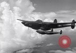Image of P-38 of 13th Army Air Force jettisons auxiliary fuel tanks Pacific Theater, 1943, second 25 stock footage video 65675030627