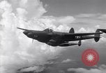 Image of P-38 of 13th Army Air Force jettisons auxiliary fuel tanks Pacific Theater, 1943, second 26 stock footage video 65675030627