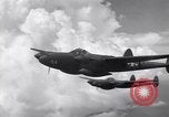 Image of P-38 of 13th Army Air Force jettisons auxiliary fuel tanks Pacific Theater, 1943, second 31 stock footage video 65675030627