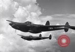 Image of P-38 of 13th Army Air Force jettisons auxiliary fuel tanks Pacific Theater, 1943, second 47 stock footage video 65675030627