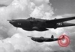 Image of P-38 of 13th Army Air Force jettisons auxiliary fuel tanks Pacific Theater, 1943, second 52 stock footage video 65675030627