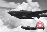 Image of P-38 of 13th Army Air Force jettisons auxiliary fuel tanks Pacific Theater, 1943, second 55 stock footage video 65675030627