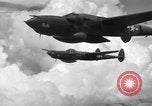 Image of P-38 of 13th Army Air Force jettisons auxiliary fuel tanks Pacific Theater, 1943, second 57 stock footage video 65675030627