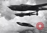 Image of P-38 of 13th Army Air Force jettisons auxiliary fuel tanks Pacific Theater, 1943, second 59 stock footage video 65675030627