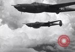 Image of P-38 of 13th Army Air Force jettisons auxiliary fuel tanks Pacific Theater, 1943, second 60 stock footage video 65675030627