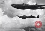 Image of P-38 of 13th Army Air Force jettisons auxiliary fuel tanks Pacific Theater, 1943, second 61 stock footage video 65675030627