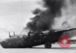 Image of C-87 in flames China, 1943, second 42 stock footage video 65675030937