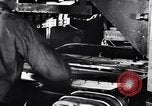 Image of Affixing car frame to chassis Dearborn Michigan USA, 1937, second 8 stock footage video 65675031007