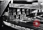 Image of Affixing car frame to chassis Dearborn Michigan USA, 1937, second 14 stock footage video 65675031007