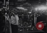 Image of Affixing car frame to chassis Dearborn Michigan USA, 1937, second 17 stock footage video 65675031007