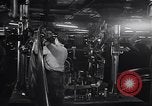 Image of Affixing car frame to chassis Dearborn Michigan USA, 1937, second 18 stock footage video 65675031007