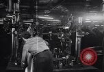 Image of Affixing car frame to chassis Dearborn Michigan USA, 1937, second 22 stock footage video 65675031007